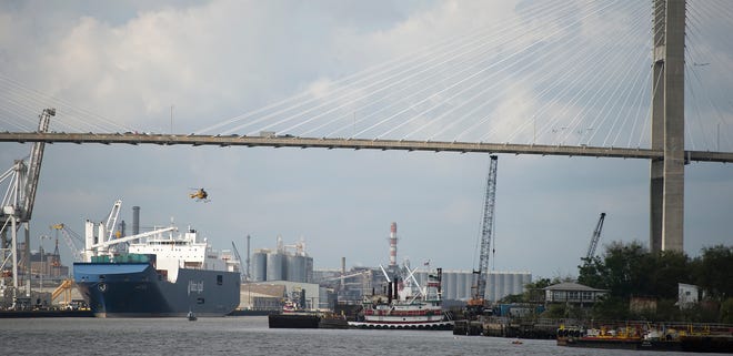 A Savannah-Chatham police helicopter searches the Savannah River after a man jumped from Talmadge Memorial Bridge early Tuesday afternoon. (Josh Galemore/Savannah Morning News)