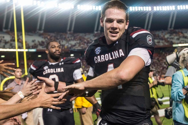 South Carolina quarterback Jake Bentley celebrates with fans after South Carolina's 24-21 win over Tennessee in an NCAA college football game Saturday, Oct. 29, 2016, in Columbia, S.C. (AP Photo/Sean Rayford)