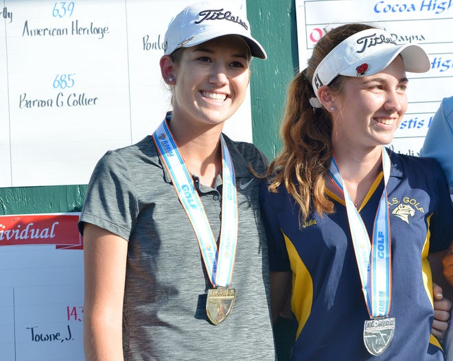 Sebring's Kendall Griffin and Eustis' Julia Towne pose for a portrait together after placing first and second respectively at the girl's Class 2A state golf championship at Mission Inn golf course on Wednesday, Nov. 2, 2016 in Howey-in-the-Hills, Fla. (Amber Riccinto/ Daily Commercial)