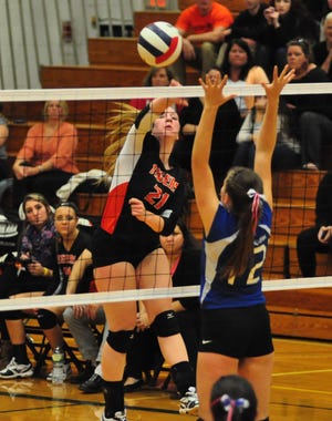 Farmington's Kayleigh MacDougall, left, goes up for one of her 24 kills during Wednesday's Division III semifinal against Winnisquam. The Tigers won the match in five sets.
