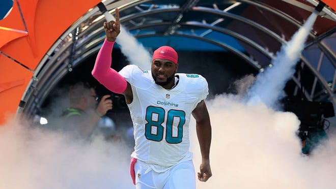MIAMI GARDENS, FL - OCTOBER 09: Dion Sims #80 of the Miami Dolphins enters the field during player introductions prior to a game against the Tennessee Titans at Hard Rock Stadium on October 9, 2016 in Miami Gardens, Florida. (Photo by Chris Trotman/Getty Images)