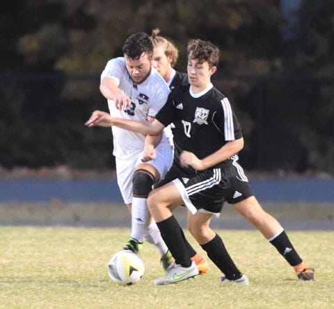 Forestview's Nick Fertitta (17) defends against East Gaston’s Thomas Moore during a 2-1 Jaguars win on Oct. 26. Both teams qualified for the 3A soccer playoffs. Diego Romero / Special to the Gazette