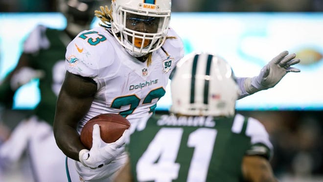 Miami Dolphins running back Jay Ajayi (23) at MetLife Stadium in East Rutherford, New Jersey on November 29, 2015. (Allen Eyestone / The Palm Beach Post)