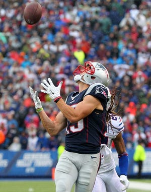New England Patriots wide receiver Chris Hogan (15) catches a 53 yard touchdown pass against Buffalo Bills cornerback Stephon Gilmore (24) during the first half of an NFL football game Sunday, Oct. 30, 2016, in Orchard Park, N.Y. (AP Photo/Bill Wippert)