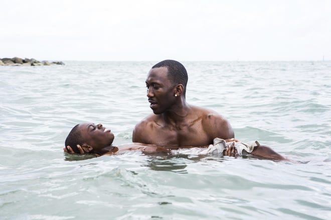 This image shows Alex Hibbert, left, and Mahershala Ali in a scene from the film, "Moonlight." (A24)