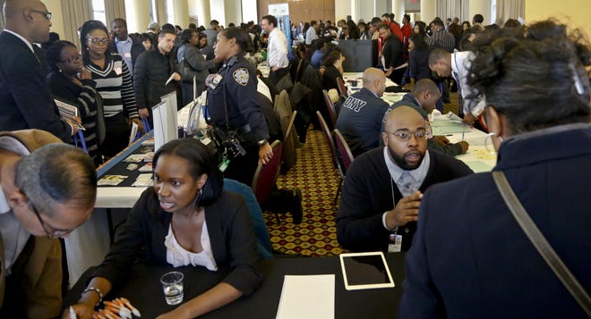 Job seekers attend the New York Department of Citywide Administrative Services (DCAS) 2016 job fair, Wednesday Nov. 2, 2016, in New York.  US employers added solid 161,000 jobs in October 2016, as unemployment rate fell to 4.9 percent.(AP Photo/Bebeto Matthews)