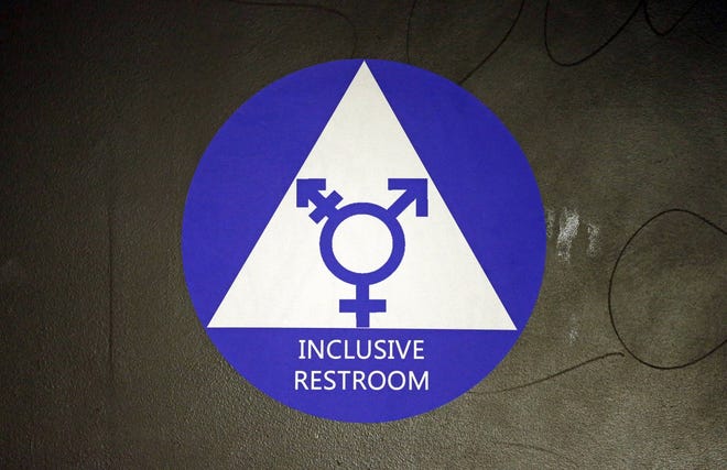 In this May 17, 2016, file photo, a new sticker designates a gender neutral bathroom at Nathan Hale high school in Seattle. (Associated Press)