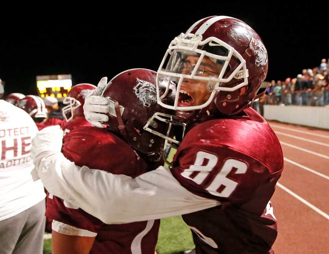 Littlefield's Adam Armstrong (70) and Daniel Pedroza (86) celebrate after the game against River Road, Friday, Nov. 4, 2016, at Wildcat Stadium in Littlefield, Texas. (Brad Tollefson/A-J Media)