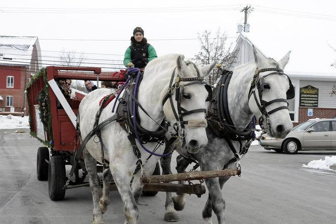 It's not Christmas in the Village without horse and wagon rides down Main Street in Victor. Melody Burri/Messenger Post Media