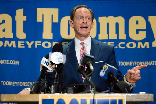 FILE - In this Oct. 11, 2016, file photo, Sen. Pat Toomey, R-Pa., campaigns in Villanova, Pa. Sen. Toomey is turning to the target of some of his toughest criticism to help him in his life-or-death re-election bid in Democratic-leaning Pennsylvania: President Barack Obama. (AP Photo/Matt Rourke, File)
