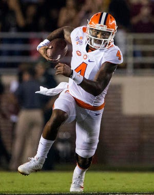 FILE - In this Saturday, Oct. 29, 2016, file photo, Clemson quarterback Deshaun Watson runs during the first half of the team's NCAA college football game against Florida State in Tallahassee, Fla. Watson threw for 378 yards, two touchdowns and two interceptions against Florida State. (AP Photo/Mark Wallheiser, File)