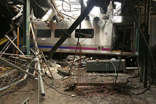 FILE - This Oct. 1, 2016, file photo provided by the National Transportation Safety Board shows damage done to the Hoboken Terminal in Hoboken, N.J., after the Sept. 29 commuter train crash. Lawmakers investigating September's deadly New Jersey Transit train crash could finally get a chance to question top agency officials who skipped out on an oversight hearing last month. NJ Transit says new executive director Steve Santoro and other key leaders will testify before the legislative committee on Friday, Nov. 4, 2016. (Chris O'Neil/NTSB photo via AP, File)
