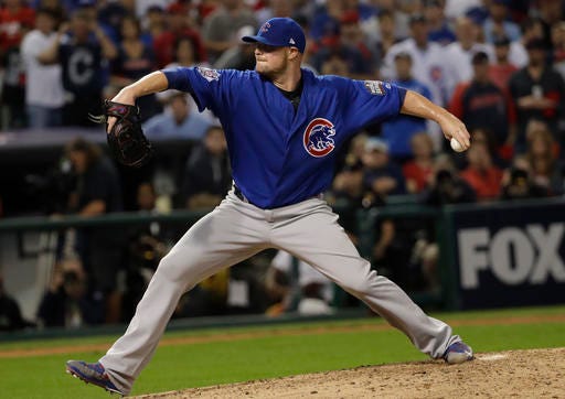 Chicago Cubs pitcher Jon Lester throws during the fifth inning of Game 7 of the Major League Baseball World Series against the Cleveland Indians Wednesday, Nov. 2, 2016, in Cleveland. (AP Photo/David J. Phillip)