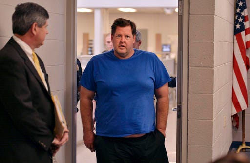 Todd Kohlhepp is escorted into a Spartanburg County magistrate courtroom, Friday, Nov. 4, 2016, in Spartanburg, S.C.. Kohlhepp, a 45-year-old registered sex offender with a previous kidnapping conviction, appeared at a bond hearing Friday on a kidnapping charge in connection to a woman being found chained inside a storage container on a property in Woodruff, S.C. More charges will be filed later, the prosecutor told the court.
 (Tim Kimzey/The Spartanburg Herald-Journal via AP)