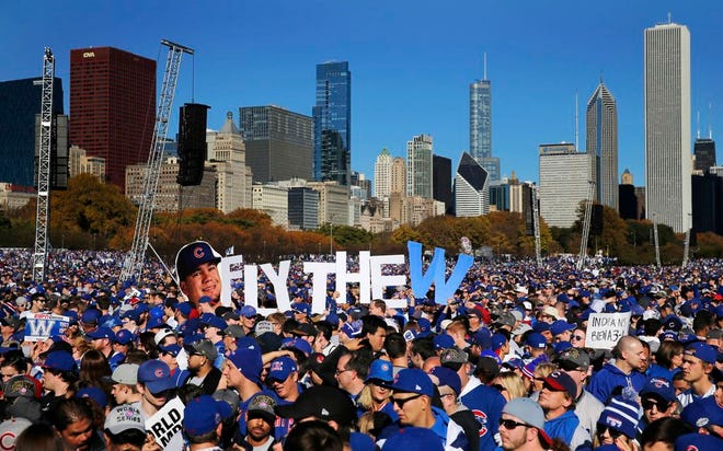 Chicago Cubs fans celebrate during a rally in Grant Park honoring the World Series baseball champions Friday, Nov. 4, 2016, in Chicago.