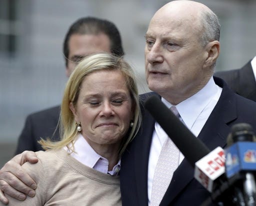 Bridget Anne Kelly, left, former Deputy Chief of Staff for New Jersey Gov. Chris Christie, is held by her lawyer Michael Critchley while talking to reporters after she was found guilty on all counts in the George Washington Bridge traffic trial at Martin Luther King, Jr., Federal Court, Friday, Nov. 4, 2016, in Newark, N.J. (AP Photo/Julio Cortez)