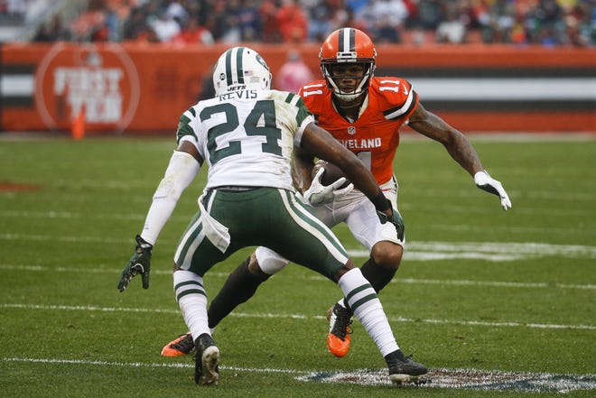 Cleveland Browns wide receiver Terrelle Pryor runs the ball past New York Jets cornerback Darrelle Revis in the first half of a NFL game in Cleveland. Revis openly acknowledges that he is no longer the dominant player he was just a few years ago in an AP interview. (AP Photo/Ron Schwane)
