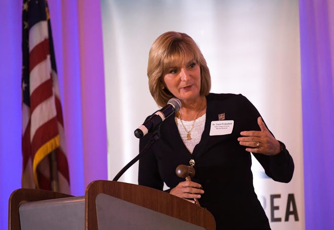 Dr. Carol Probstfeld, 2017 incoming chairwoman of the Bradenton Area Economic Development Corp., introduces the keynote speaker during the annual update luncheon in Lakewood Ranch on Friday. HERALD-TRIBUNE STAFF PHOTO / DAN WAGNER