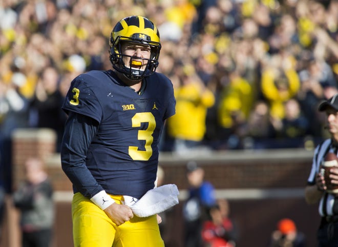 Michigan quarterback Wilton Speight (3) celebrates his touchdown in the first quarter of an NCAA college football game against Maryland in Ann Arbor, Mich., Saturday, Nov. 5, 2016. (AP Photo/Tony Ding)