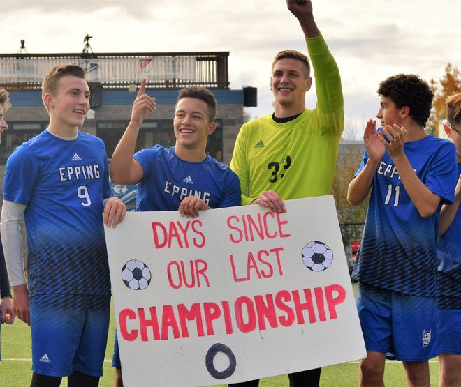 Epping players, from left, Cooper Garrow, Aissa Zerguine, Jackson Rivers and Mark Marasca celebrate after their team beat Littleton for the first boys soccer championship in school history Saturday at SNHU.

Photo by Mike Zhe/Seacoastonline