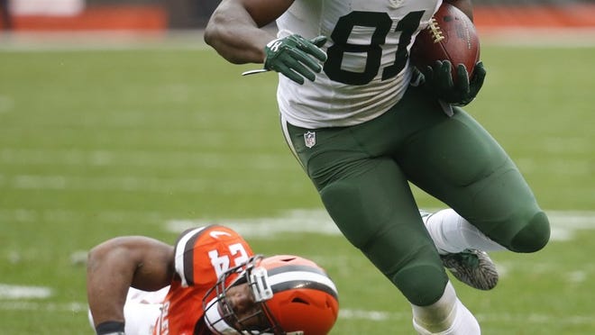 FILE - In this Oct. 30, 2016, file photo, New York Jets wide receiver Quincy Enunwa (81) breaks away from Cleveland Browns strong safety Ibraheim Campbell, left, on a touchdown run in the second half of an NFL football game, in Cleveland. The 2014 sixth-round draft pick out of Nebraska leads New York with 36 receptions for 502 yards and three touchdowns, including a 57-yarder last week in which he ran through four tackles to get into the end zone. (AP Photo/Ron Schwane, File)