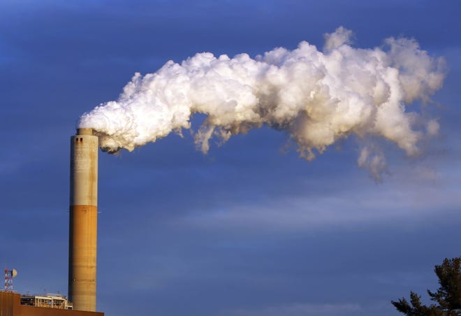 Jim Cole/AP In this Jan. 20, 2015 file photo, steam billows from the chimney or a coal-fired Merrimack Station in Bow, N.H. USA. The Paris Agreement on climate change comes into force Friday Nov. 4, 2016, after a year of remarkable success in international efforts to slash man-made emissions of carbon dioxide and other global warming gases.
