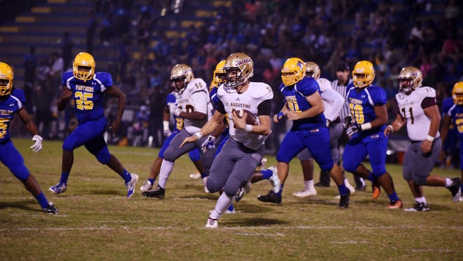 CHRISTINA.KELSO@STAUGUSTINE.COM — St. Augustine High School Yellow Jackets senior quarterback Cole Northrup runs the ball in the team’s the 97th matchup against the Palatka High School Panthers on Friday, November 4, 2016 at Veteran’s Memorial Stadium in Palatka.
