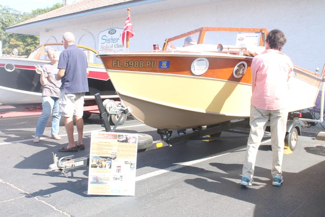 Visitors look at classic Carter Craft boats during Saturday's Carter Crafts and Carter Boat Show at the Bay County Historical Society. COLLIN BREAUX/The News Herald