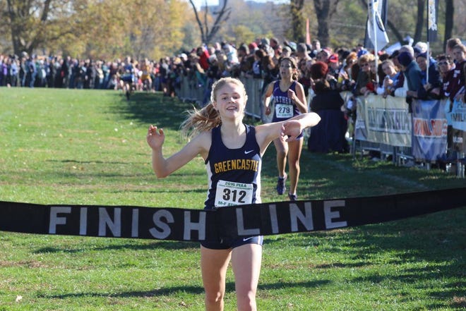 Greencastle-Antrim's Taryn Parks crosses the finish line to win Saturday's PIAA girls' AA cross country championship race at Hershey's Parkview Course.