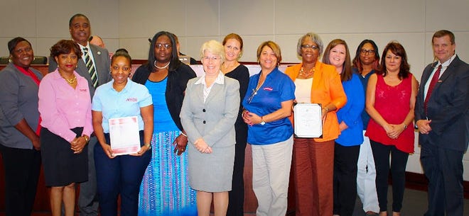 Ascension's finance staff members were recognized at the Oct. 18 Ascension Parish School Board meeting. Pictured from left are Deshonna Jackson, Joann Butler, Representative Ed Price, Lakeita Dennis, Tolia Duplessis, Diane Allison, Nicole Breaux, Dionne Davis, Jessica Geason, Anne Waguespack, Samantha Smothers, Shelly Madere and Superintendent David Alexander.