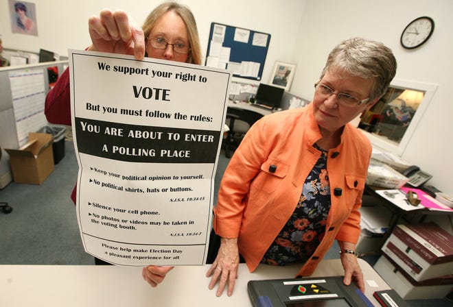 Photo by Daniel Freel/New Jersey Herald - Marge McCabe, county Board of Elections administrator, right, and Ellen Griffiths, deputy administrator, discuss voter security issues at the Board of Elections offices in Newton.