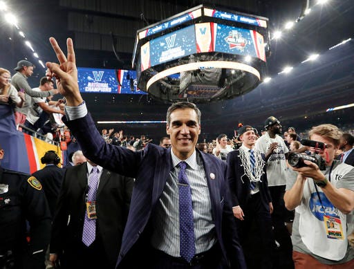 ADVANCE FOR WEEKEND EDITIONS, NOV. 5-6 FILE - In this April 4, 2016, file photo, Villanova head coach Jay Wright celebrates after they defeated North Carolina 77-74 in the championship game of the the NCAA Final Four college tournament in Houston. Wright has always been one of basketball’s snappiest dressers. But it’s his latest accessory that has everyone talking – Villanova’s national championship ring. Wright says he won’t change and neither will the Wildcats as they reign as champions for the first time in three decades. (AP Photo/David J. Phillip, File)