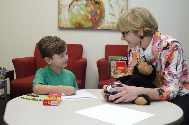 A 7-year-old boy meets with Lynna Hollis, a child and adolescent psychiatrist, at the Nashville campus of Centerstone, a community mental health provider. MUST CREDIT: Michael Rivera - Courtesy of Centerstone.