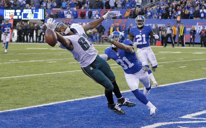 Philadelphia Eagles wide receiver Jordan Matthews, left, can't make the catch in the end zone under pressure from New York Giants cornerback Trevin Wade on 4th down during the fourth quarter of a NFL game on Sunday in East Rutherford, N.J. The Giants won 28-23. (AP Photo/Bill Kostroun)