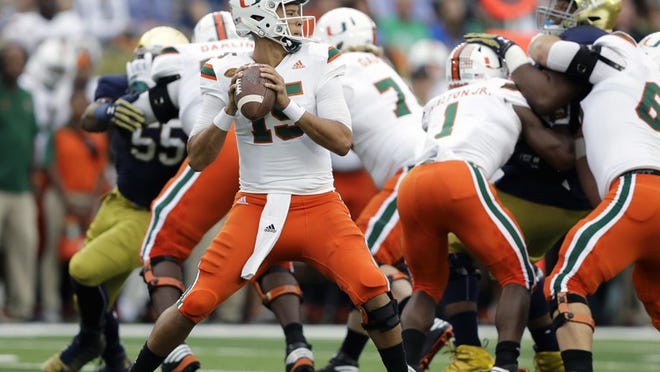 Miami quarterback Brad Kaaya looks to throw during the first half of an NCAA college football game against Notre Dame, Saturday, Oct. 29, 2016, in South Bend, Ind. (AP Photo/Darron Cummings)