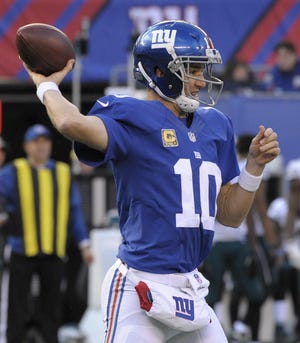 Giants quarterback Eli Manning throws against the Eagles during the third quarter. The Associated Press