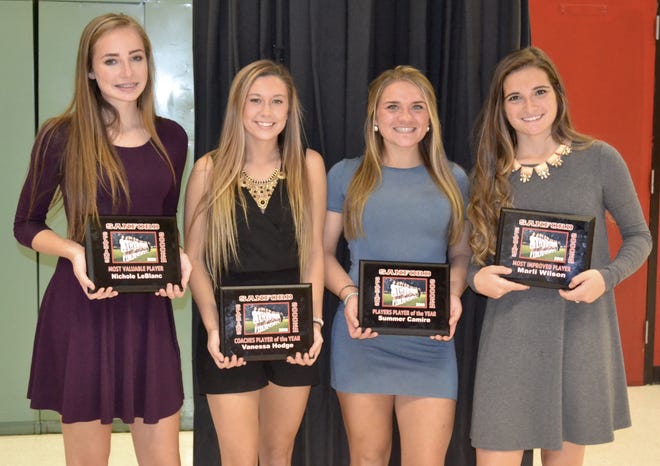 Nichole LeBlanc, left, Vanessa Hodge, Summer Camire and Marli Wilson are all seen here with the awards they received during the recent banquet for Sanford High's girls soccer team. COURTESY PHOTO BY CHERYL CAMIRE.
