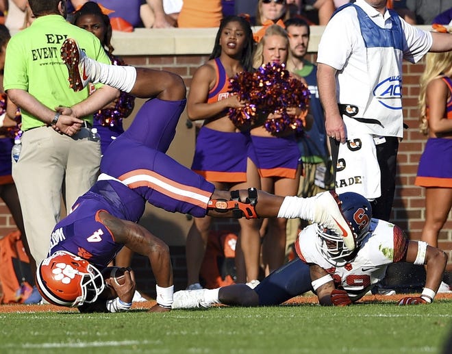 Clemson's quarterback Deshaun Watson takes a hard landing after being tackled by Syracuse's Davion Ellison during the first half of a college football game on Saturday. (AP Photo/Richard Shiro)