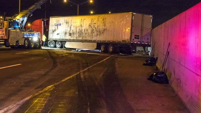 A tractor-trailer driver fell asleep behind the wheel in the early morning of Oct. 26, flipping the truck and blocking traffic on Interstate 95 in Lake Worth for hours. It was one of the most recent cases in Palm Beach County where drowsy driving led to a crash. (Lannis Waters / The Palm Beach Post)