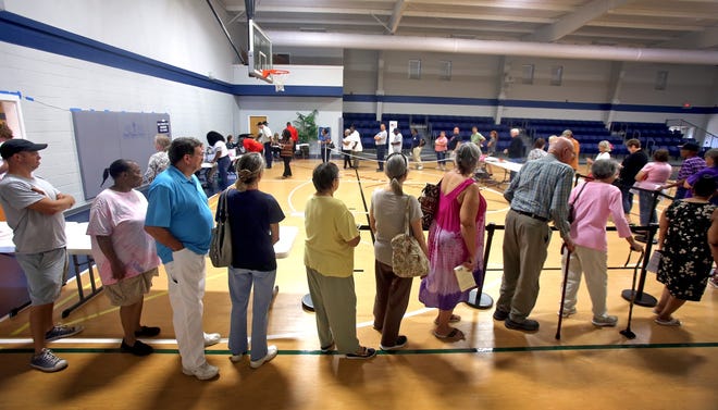 People wait in line to vote at Bethel Baptist Church during early voting. (Star file photo)