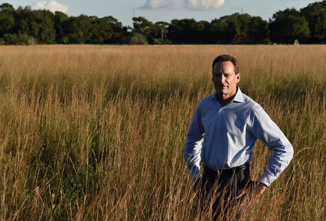 Lakewood Ranch's commercial president, Kirk G. Boylston, stands in a field where shops and restaurants would be built as part of a biomedical research park development. HERALD-TRIBUNE ARCHIVE / 2015 / THOMAS BENDER