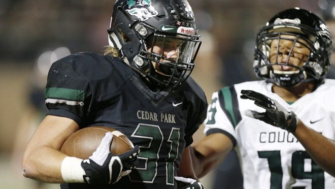 Tyler Lavine (31) and his Cedar Park teammates have rolled to a 10-0 record this season, but they will open the Class 5A, Division I football playoffs on the road. CREDIT: Stephen Spillman/For American-Statseman