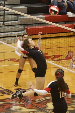 Amy Gottschalk going in for a kill against DC-G during the Tigers last regional game of the season.