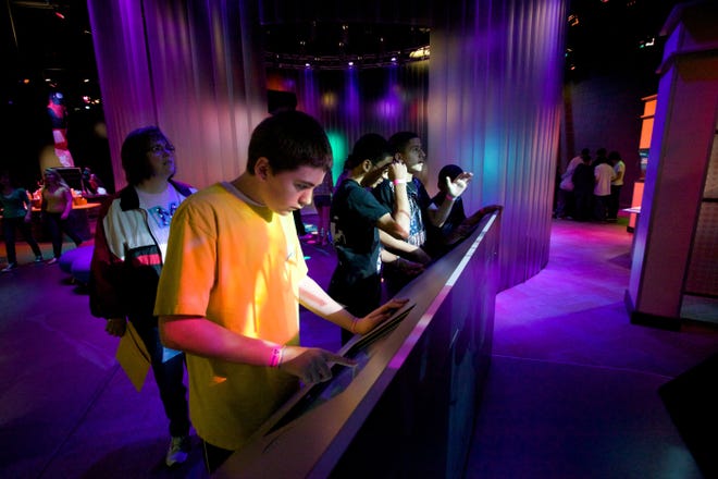 Museum visitors take part in an interactive exhibit at Discovery Place in Charlotte. New exhibits, special hours and veterans recognition are all happening in November. PHOTO COURTESY OF DISCOVERY PLACE.