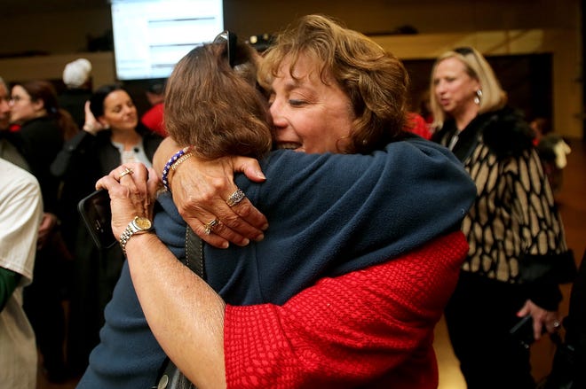 Brittany Randolph/The StarRegister of Deeds candidate Betsy Harnage receives a hug from Robin Gassman while waiting for results to come in on election night at Cleveland Volunteer Fire Department.