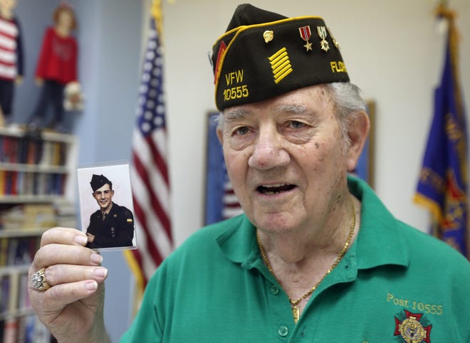 Veteran Jim Phelps shows a photo of himself as an Army recruit at age 15. Phelps service spanned World War II, Korea and Vietnam. PATTI BLAKE/The News Herald