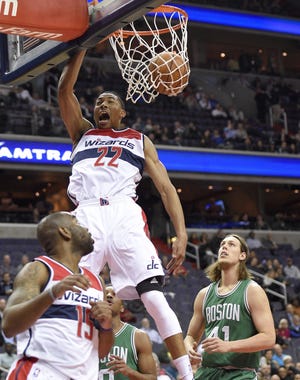 Wizards forward Otto Porter Jr. throws down a dunk during the first half of Washington's 118-93 win over the Celtics on Wednesday night.