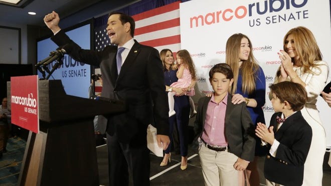 Sen. Marco Rubio acknowledges the cheers from supporters after winning a second term in office. (AP Photo/Wilfredo Lee)