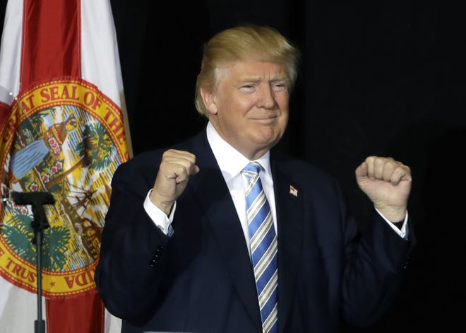 Donald Trump pumps his fist after his campaign speech Monday in Sarasota. (AP Photo/Chris O'Meara)