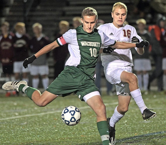 Wachusett's Jonah Smith winds up for a big kick, as Algonquin's Luke Farrell applies pressure during Wednesday's Central Masss. Division 1 soccer semifinal, at Doyle Field in Leominster. T&G Staff/Steve Lanava
